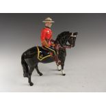 A Beswick Figure of a Royal Canadian mounted Policeman riding a black horse