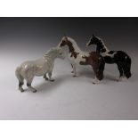 Three Beswick Ponies, skewbald, dappled grey and black and white