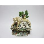 A Staffordshire Figure of Romulus and Remus with bocage background and painted details, 8in,