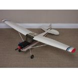 A radio controlled singel engine high winged Aircraft with petrol motor and servos, 4ft 8in