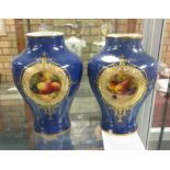 A pair of Royal Worcester baluster Vases, painted panels of fruit with decorative borders, one