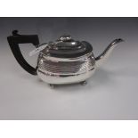 A George III silver boat shape Teapot on bun feet, London 1808