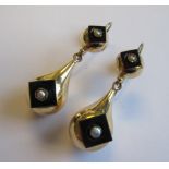 A pair of Seed Pearl and Black Onyx Ear Pendants each with half sphere suspending tear drop both set