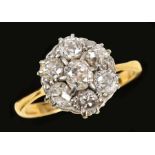 A Diamond Cluster Ring claw-set cushion-cut stone, estimated 0.35cts, within a frame of six old-