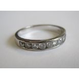 A Diamond Half Eternity Ring channel-set brilliant-cut stones, total diamond weight 0.5cts, in