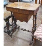 A Victorian walnut Sewing Table with satinwood inlay, fitted interior on cheval frame with twin