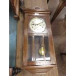 A 20th Century Wall Clock with silvered dial, two train movement in oak case, 28in, and a 19th