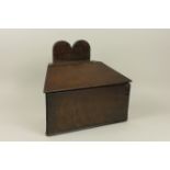 An antique oak Candle Box of tapered form with hinged cover, 12 1/2in H