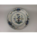 An 18th Century polychrome Delft charger (A/F)