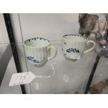 Two Worcester blue and white Cups, reeded body and shaped rim, floral designs, reeded handles