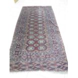 A multi-bordered Afghan Rug with central field of two rows of small guls, 4ft 4in x 8ft 8in