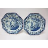 A pair of Irish delft blue and white octagonal Plates painted chinoiserie figures in punts, 8 1/2in