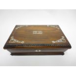 A Victorian rosewood Games Box with mother of pearl inlay, containing playing cards and cribbage