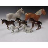 Two Beswick figures of Shire Horses, a dapple grey and a light chestnut, three brown foals and two