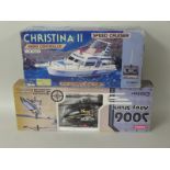 A boxed Suma Alloy Shark electric controlled helicopter and an electric boxed Speed Boat