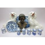 A pair of Staffordshire seated Dogs with sparsley painted details, 12in, a Delft blue and white