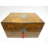 A Victorian burr walnut Dressing Case with mother of pearl inlaid cartouches, containing numerous