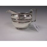 A George III silver Milk Jug of oval form with banded design, London 1805