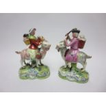 A pair 19th Century Staffordshire Welsh Tailors with children on goats having painted details, 6 1/