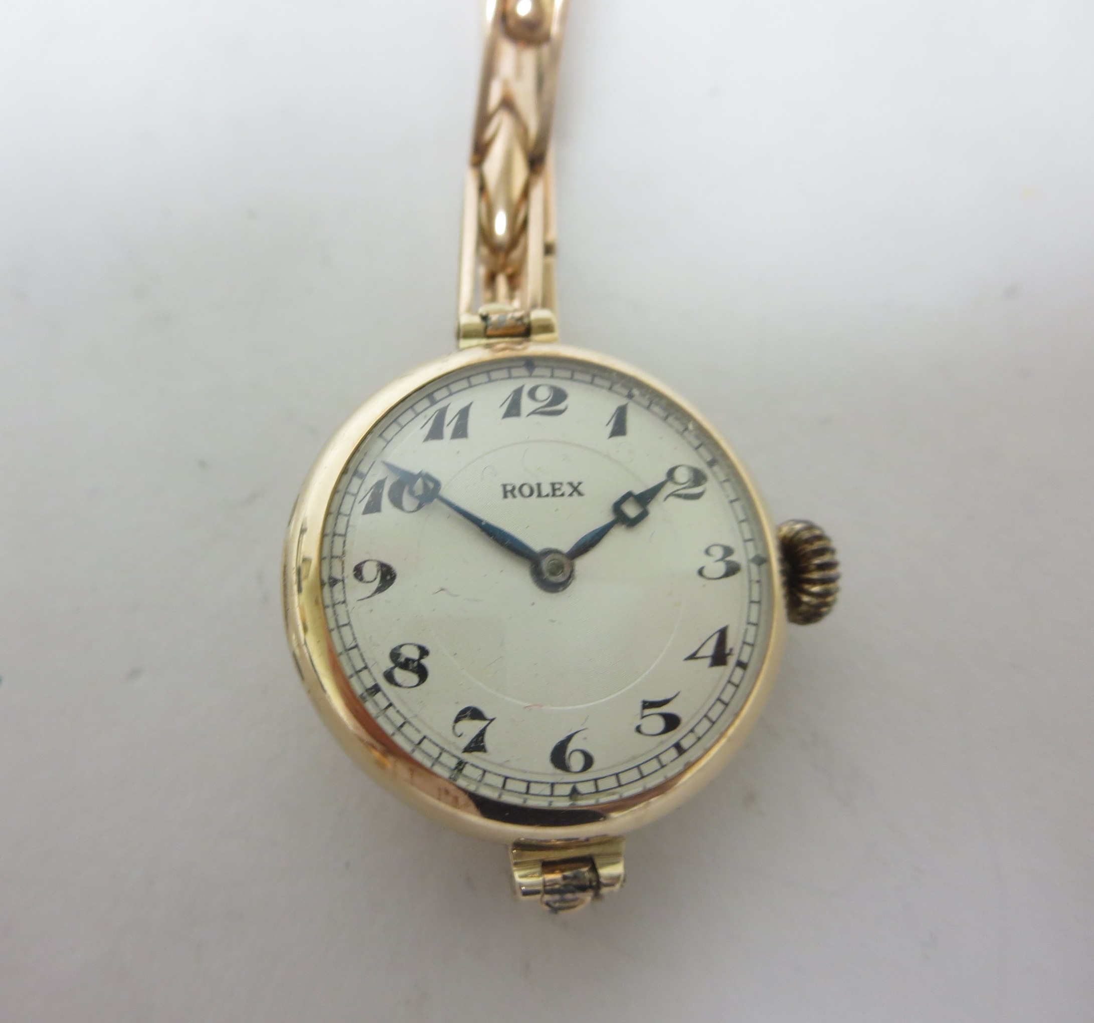 A Lady's 1950's 9ct gold Rolex Wristwatch, the signed silvered dial with engine turned centre,