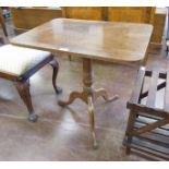 A 19th Century mahogany Pillar Table, the rectangular hinged top above a turned column on tripod