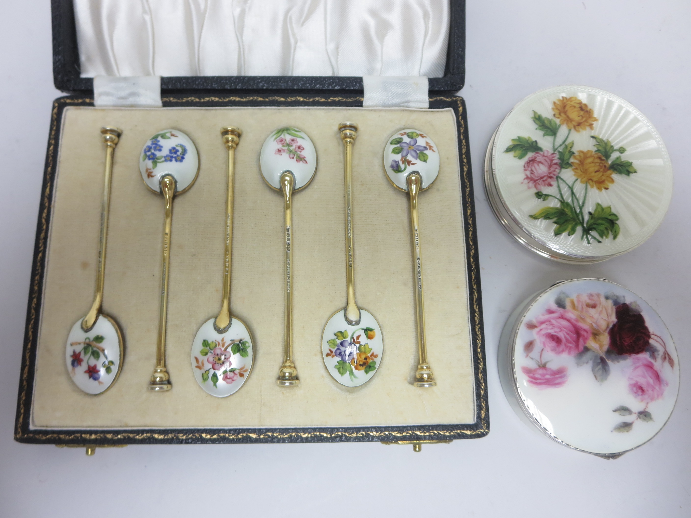 Six silver and floral enamel Coffee Spoons, Birmingham 1973, in case, and two silver and floral