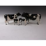 A Beswick Figure of a Friesian Bull Coddington Hilt Bar, Cow Ch. Claybury Legwater and two Calves