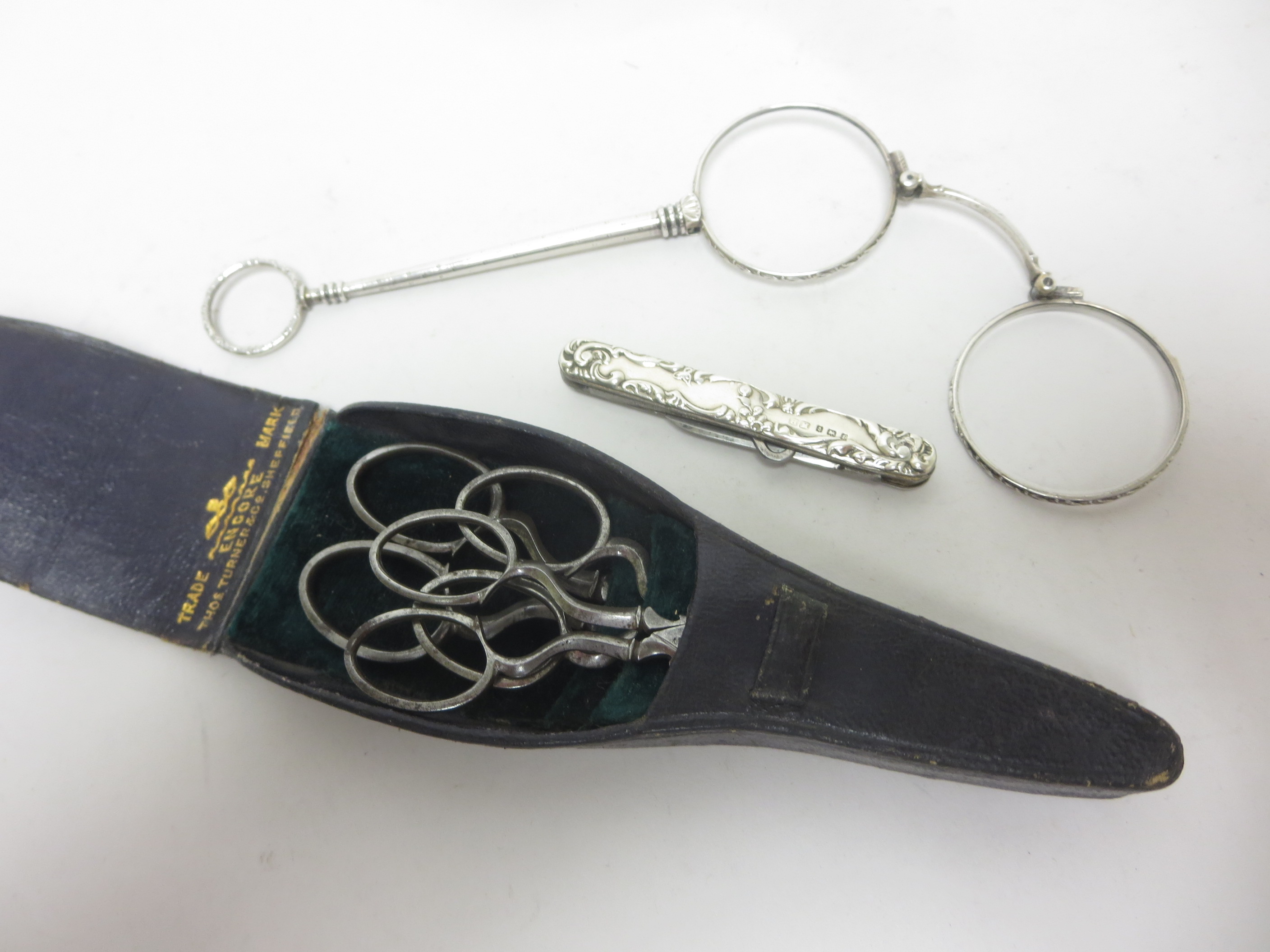 An Edward VII silver cased folding Knife and Button Hook, Birmingham 1905, pair of silver cased