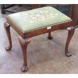 A George II style walnut Dressing Stool, the drop in woolwork top raised on carved cabriole legs and