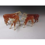 A Beswick Figure of Hereford Bull, Cow and two Calves