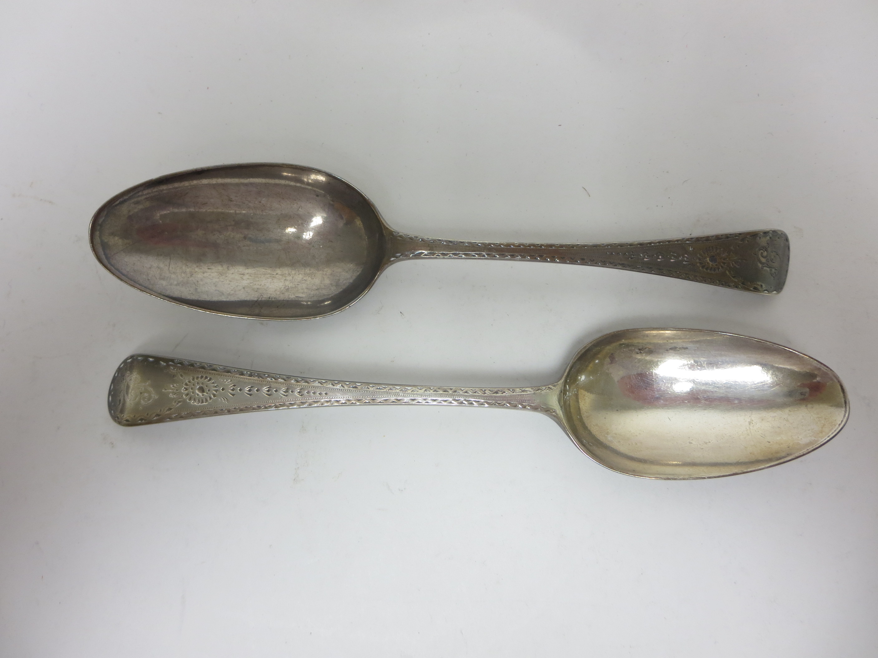 A pair of George III silver Table Spoons with bright cut decoration and engraved initial, London