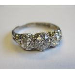 An Edwardian Diamond three stone Ring set graduated old-cut stone, estimated total weight 1.45cts,