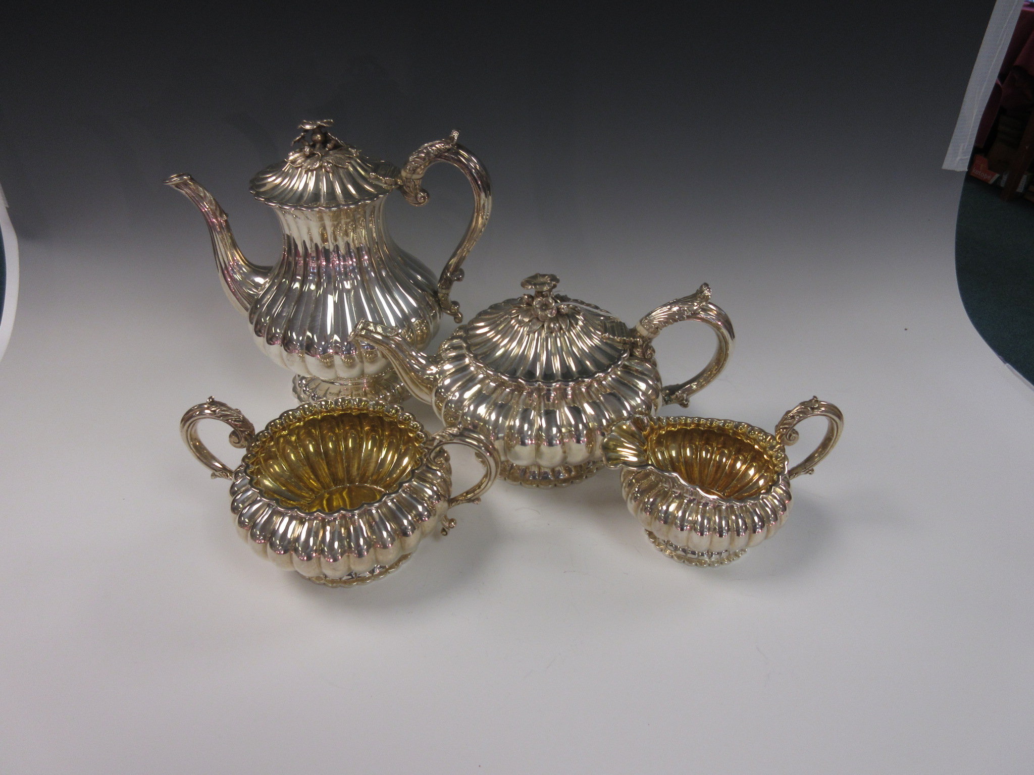 A George IV silver Tea and Coffee Service of circular fluted form with leafage scroll handles, the - Image 2 of 2