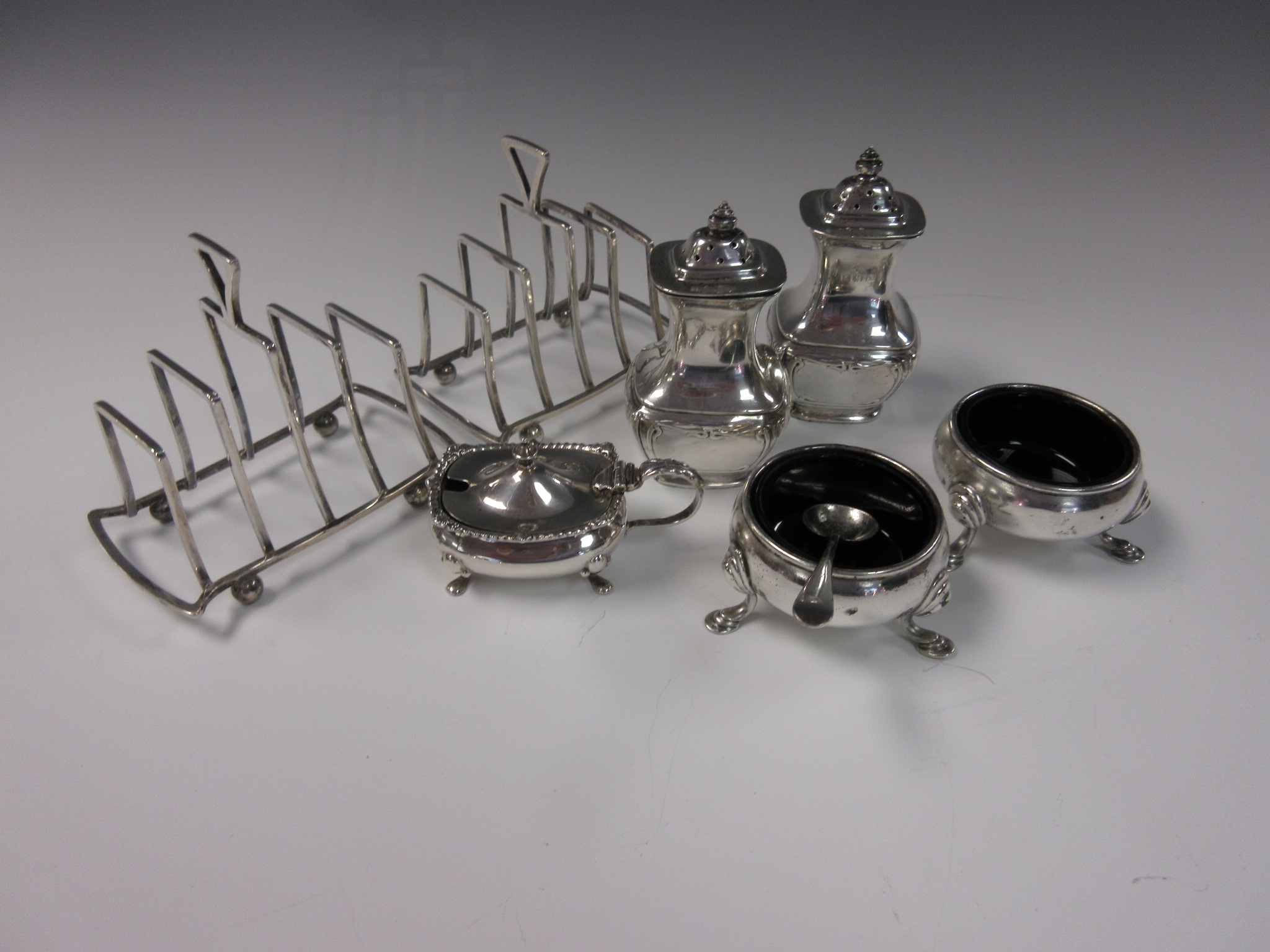 A pair of George V silver Toastracks, Birmingham 1937, pair of Cauldron Salts, London 1929, pair