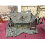 A cork Model of a rustic cottage with water wheel 30in W