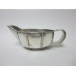 A George V silver Sauce Boat with Arts & Crafts hammered and ribbed design, London 1935 maker: AS