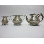 A Victorian silver three piece Tea Service embossed flowers and mythological figures, etc, vacant