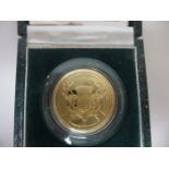 An Elizabeth II gold proof Two Pound Coin, 1986