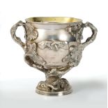 A George IV silver two-handled Goblet engraved laurel wreath cartouche, relief handshake to reverse,