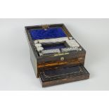 A Victorian coromandel Vanity Case, brass bound and containing silver covered jars and bottles and