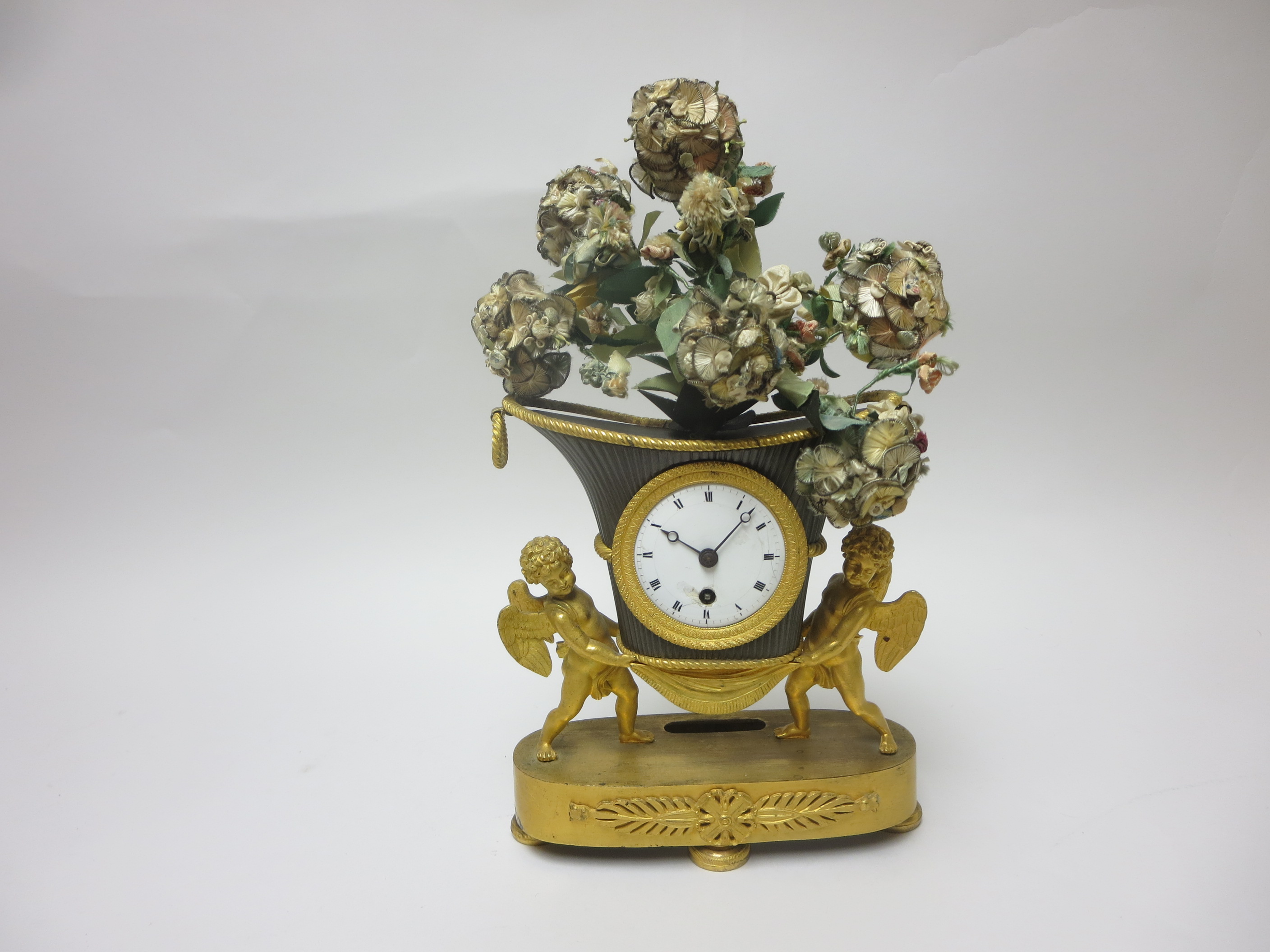 A 19th Century French Mantel Clock with white enamel dial in vase shape surround supported by two - Image 2 of 3