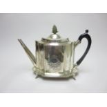 A George III silver shaped oval Teapot and Stand engraved initials within cartouche, carved