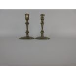 A pair of Paktong Pillar Candlesticks with knopped stems on square bases with shaped corners, 6 1/