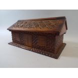A Mid 20th Century Scandinavian Walnut Box in the Form of a Small House with Profuse Chip Carved