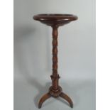 An Early 19th Century Anglo-Indian Rosewood Torchere with a Circular Top Supported on a Carved