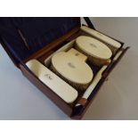 An Early 20th Century Leather Travelling Case with Monogrammed Ivory Mounted Brushes, Box,