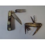 A Horn Handled Multi Tool Knife with a Horn Handled Folding Knife and Fork.