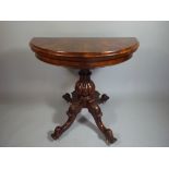 A Mid Victorian Burr Walnut Demi Lune Lift and Twist Games Table having Green Beize Playing Surface.