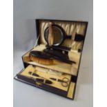 An Edwardian Cased Travelling Set with Ebony Mirror, Comb,