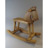 A Child's Wooden Rocking Horse.